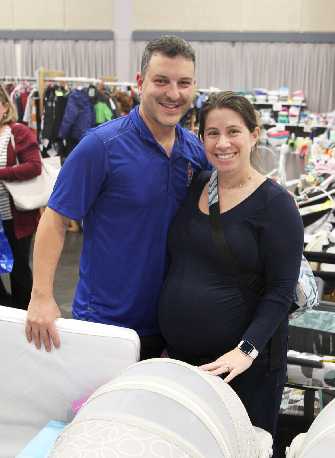 A set of expectant parents at a recent JBF sale in Overland Park.