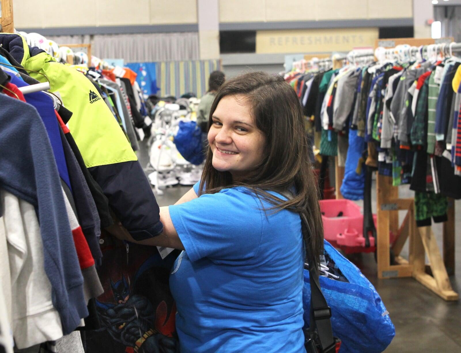 A JBF of Overland Park shopper looking through clothes